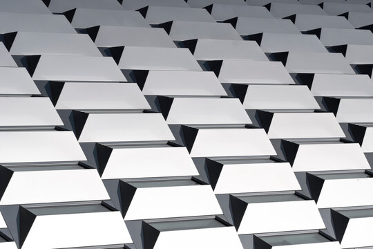 Modern architecture pattern with geometric abstract repetition in facade structure creating minimal detail and contemporary architectural background design