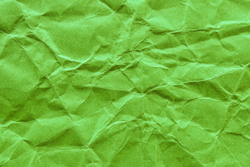 A sheet of green wrinkled thick paper as background