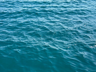 Blue sea water ripples surface background.
