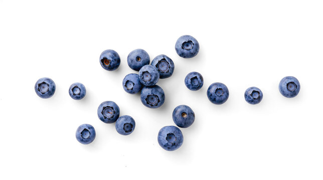 Fresh Blueberries Scattered on a Pure White Background. Blueberries isolated. Top view.