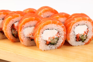 Delightful sushi rolls stacked neatly on a wooden board