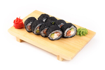 Sushi rolls arranged elegantly on a wooden plate