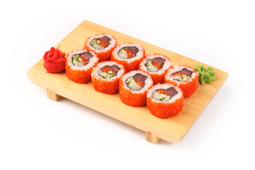 Colorful sushi rolls arranged artfully on a wooden plate
