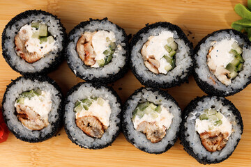 Savory sushi rolls with unique black rice and fresh ingredients