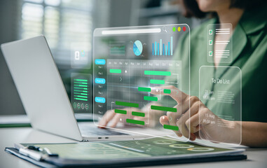 Management diagram with planning software on laptop screen.