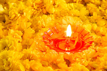 burning candle with flower