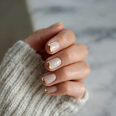 Fototapeta premium Neutral Nails with Metallic Gold Cuff at Cuticle, Minimalist French Tip for Modern Holiday Design