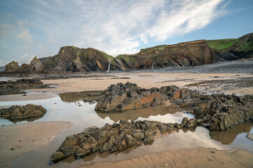 Multi coloured rock formations on Cornwall beach