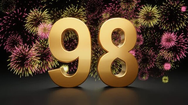 Gold number 98 with fireworks in the background. Festive scene for birthday or anniversary party