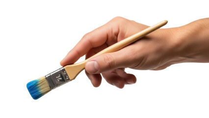 Isolated human hand holding a paint brush with blue paint on its bristles ready to work