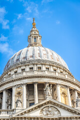 Detailed architectural view of the upper levels and the ornate golden gallery of the St. Paul&rsquo;s Cathedral dome in London, UK