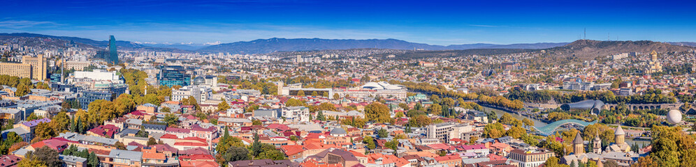Fototapeta premium Panoramic Tbilisi skyline showcasing vibrant urban growth, travel appeal and modern Caucasus city lifestyle