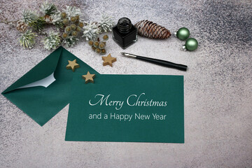 Christmas card: Letter with inkwell, fountain pen and Christmas greetings. Merry Christmas and a...