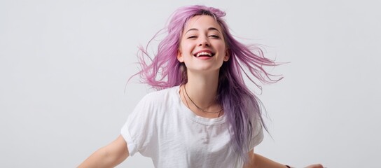 Young caucasian female with pink hair smiling, wearing white t-shirt