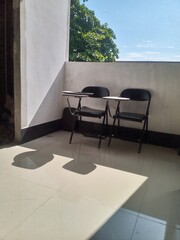 Empty Classroom with Student Desks and Chairs
