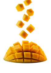 Fresh mango chunks in vibrant orange color with dynamic falling motion on white background for healthy eating isolated on white background
