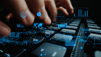 A close-up view of hands typing on a keyboard while digital data visualizations and graphs float above, representing modern technology and analytics in business. Xenic