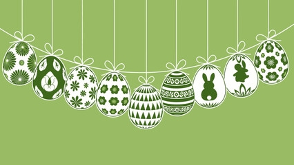 A string of nine white Easter eggs with various green patterns and bunny silhouettes hanging against a light green background.