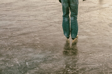 Man on icy lake on ice skate