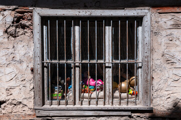 Colorful toys placed on the windowsill.