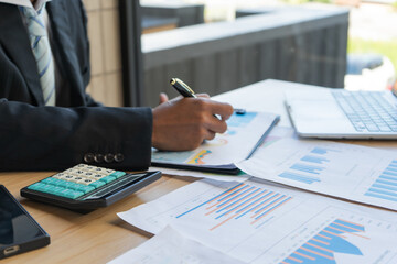 Experienced lawyer providing legal guidance in office, reviewing contracts, documents, finance, justice matters, advising clients during meetings and transactions professionally.