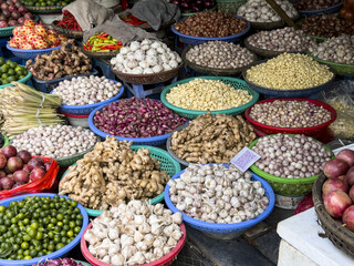 View of vibrant market scene explodes with colors and textures as spices, herbs, and produce fill bowls in Hanoi, Hanoi, Vietnam.