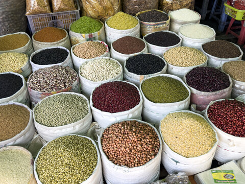 View of vibrant sacks overflowing with colorful spices, grains, and legumes create a textural mosaic of culinary delights, Hanoi, Hanoi, Vietnam.