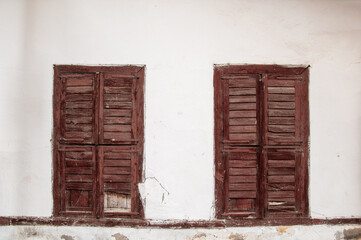 Wooden windows of a historic building.
