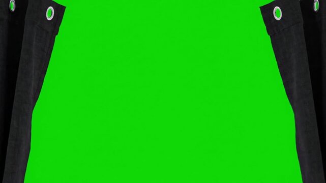 Close-up of black jacket sleeves with green buttons on a chroma key background.