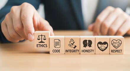 Hand places wooden cube with ethics symbol next to other cubes