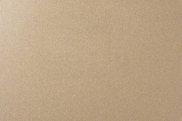 A full-frame abstract background of textured golden-bronze material with a subtle metallic shimmer