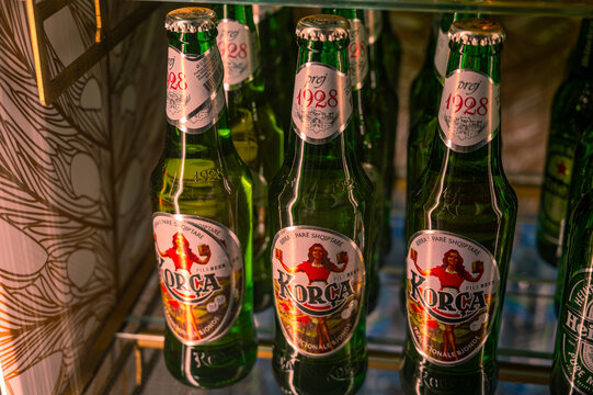 Kor&ccedil;a beer in glass bottles displayed in a refrigerator, showcasing a popular Albanian lager and chilled beverages in Durres, Albania 10.10.2025