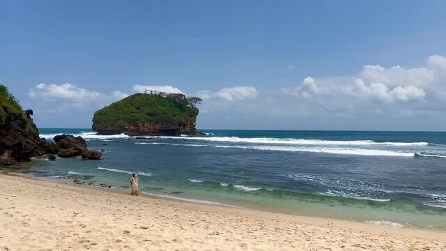 Romantic Couple Enjoying Vacation at Watu Karung Beach, Pacitan, Indonesia