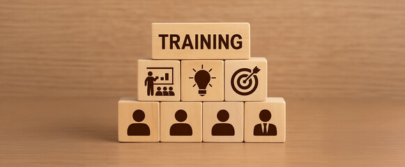 Wooden Blocks with Training Icon Representing Employee Learning and Development Concept