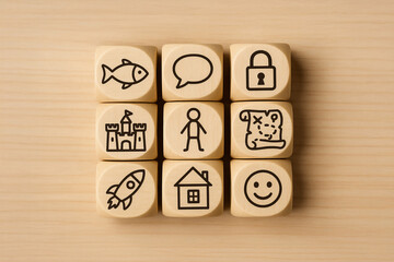 Wooden Blocks with Story Tale and Childhood Icons Arranged in Grid on Light Wooden Background
