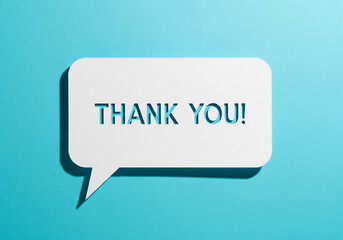 Fototapeta premium Thank you message for card, presentation, business. Expressing gratitude, acknowledgment and appreciation. Minimalist abstract design with white cut out paper on cyan background. 