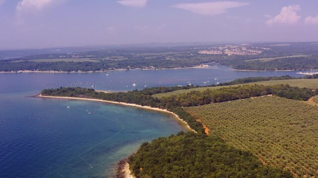 Aerial view of charming tourist town of Porc, Croatia, with historic buildings and coastal scenery. Perfect for travel, tourism, vacation,  Mediterranean lifestyle concepts. 