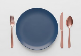 Matte navy blue dinner plate is set with rose gold cutlery on a light background