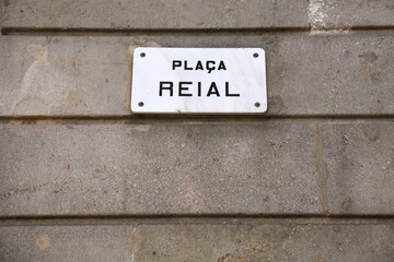 Placa Reial - square name sign in Barcelona. Streets of Barcelona, Spain.