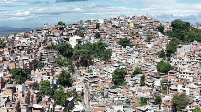 Aerial drone view of Favela Of Cantagalo, Rocinha favelas spread out on the mountain in Sao Conrado , Rio de Janeiro, Brazil.