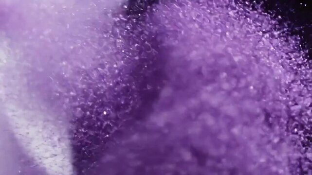 Purple Fizzy Powder Dissolving in Water Creating Bubbles Macro Shot.