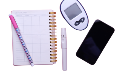 Pregnancy test kit and accessories on a white background viewed from above