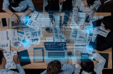 A dynamic team of diverse professionals engaging in a collaborative meeting, analyzing data and strategizing with AI tools and digital interfaces for effective solutions. Trope