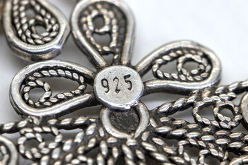 Silver jewelry , 925 silver number sign. White background, filigree