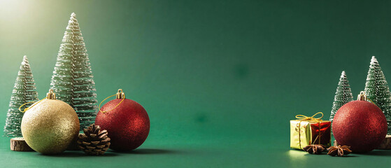 Minimal Christmas background with deep green tone, soft light gradient and subtle festive glow, clean modern holiday style with large copy space, ideal for banners, ads and seasonal design