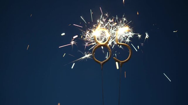 85 years anniversary celebration festive background made with Bengal fires in the form of number Eighty five.