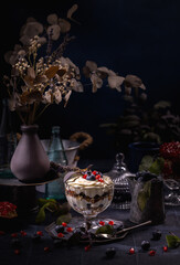 Layered berry parfait with cream and granola dessert