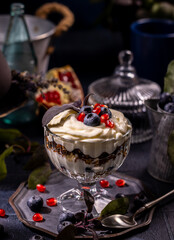 Yogurt parfait with granola, blueberries, and pomegranate seeds
