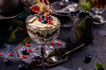 Berry parfait dessert with whipped cream and fresh fruits