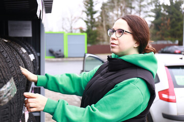 the girl at the gas station refuels the car
